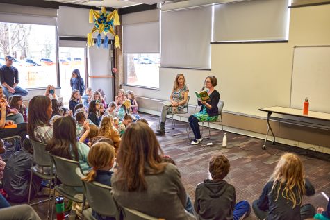 Tara Dairman, a middle-grade author, shows a group of children her newly released book, The Girl from Earth’s End March 26. The fictional book is about a girl who loses one of her two fathers and gets a genderfluid roommate. The book is aimed at kids around the ages of nine to 12.