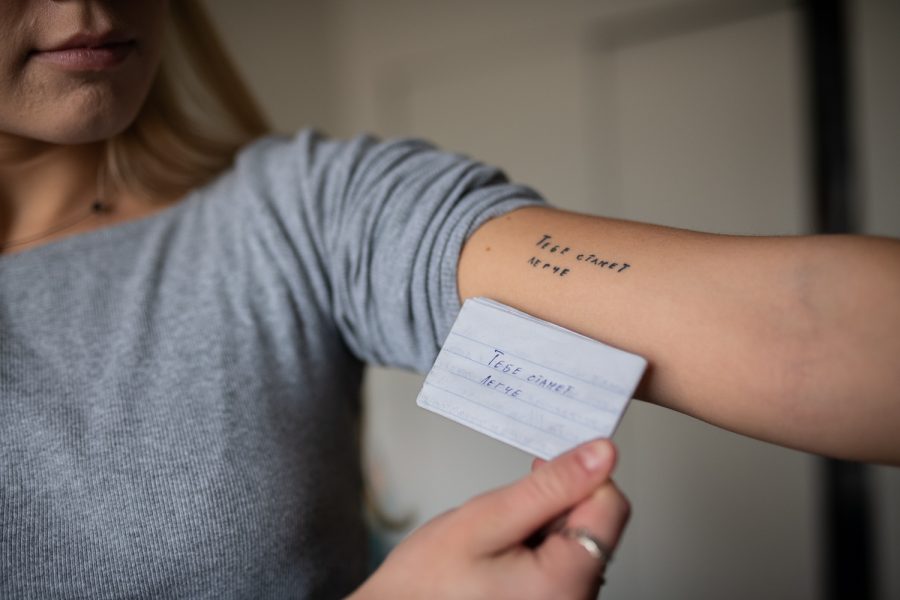Ukrainian Colorado State University student Lucie Michelizzi shows the tattoo she got in honor of her partner, who died fighting in the Russia-Ukraine War this past summer, March 8. Copied from a letter her partner, Artem Le, wrote for her, the tattooed phrase loosely translates to “You will get through this,” or “You will feel better.”