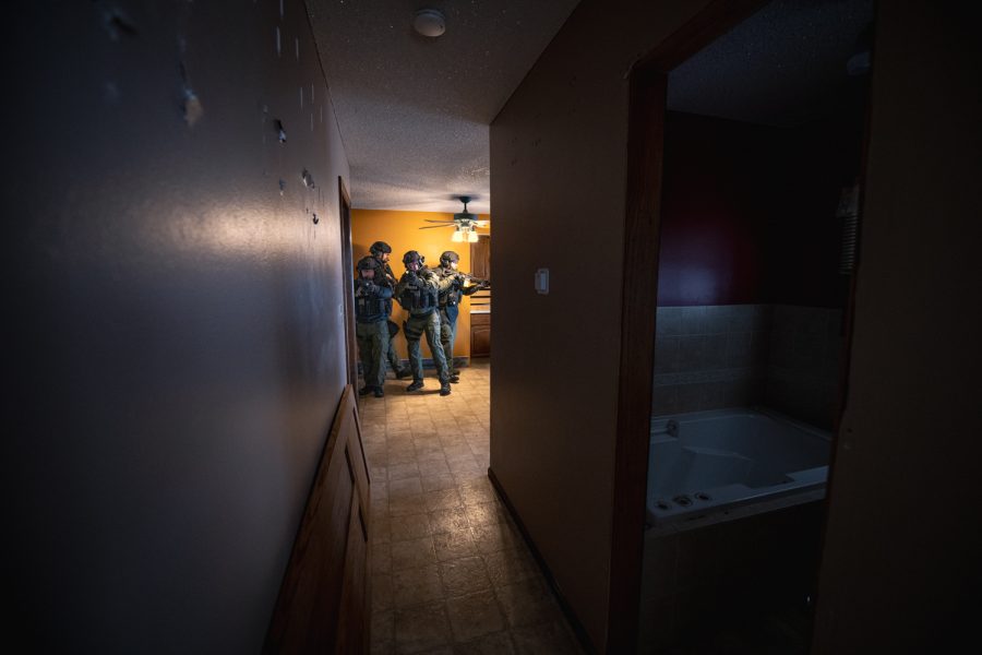 Members of the Fort Collins Police Services Special Weapons and Tactics team practice clearing a house during one of the teams’ monthly trainings Feb. 15.