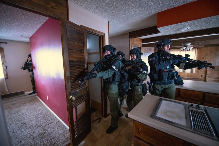 Members of the Fort Collins Police Services SWAT team practice at a borrowed abandoned house Feb. 15. As an on-call team, every SWAT response is a collateral duty, which means most members are working other jobs or beats and can have officers responding to a number of situations. To handle the situations, the team trains 20-40 hours every month on a variety of scenarios, including high-risk warrants, barricaded suspects, search warrants, hostage rescues, domestic abuse and active shooters.