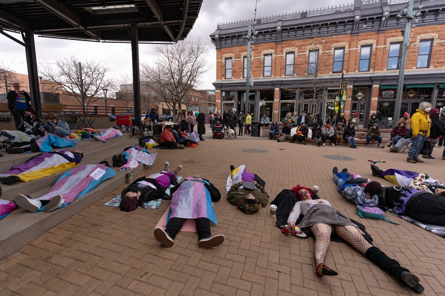 Participants of the International Transgender Day of Visibility die-in lie on the ground in Old Town Square in Fort Collins to demonstrate the lethal harm of transphobia March 31.
