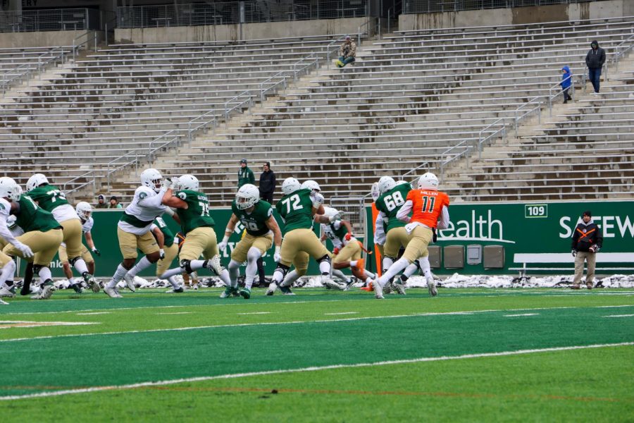 The Colorado State University football team plays against each other during the Green vs. Gold spring game in Canvas Stadium April 22.