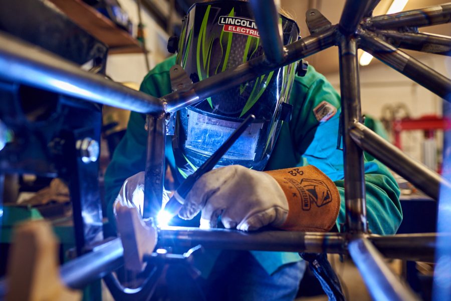 Liam Kjosen, senior mechanical engineering student, welds tabs for components to mount onto the frame March 4. These tabs connect various parts to the frame of the vehicle.