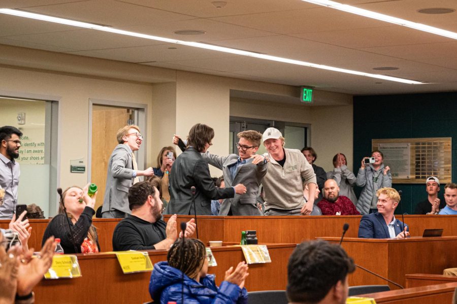 Nick DeSalvo and Alex Silverhart hug each other after they are announced as next years president and vice president of the Associated Students of Colorado State University in the senate champers April 5.