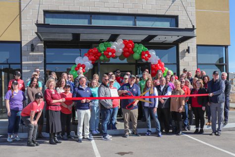 Owners David and Jessica Zumbrun cut the ribbon for the grand opening with supporters outside of Chicken Salad Chick in Greeley, Colorado April 5. 
