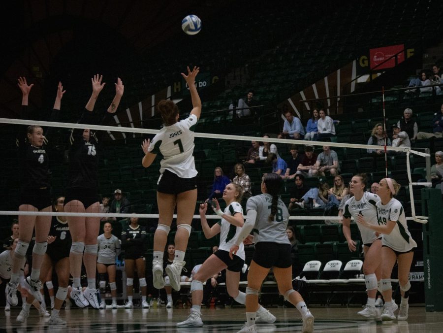 Malaya Jones, 1, jumps up to spike the ball and earns a point for her team, leading CSU to victory.