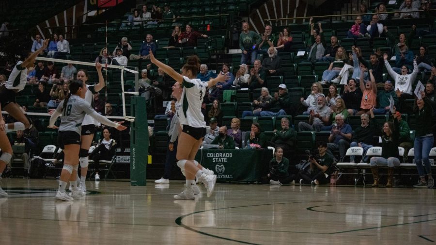 Players and the crowd celebrating the first set win for CSU.