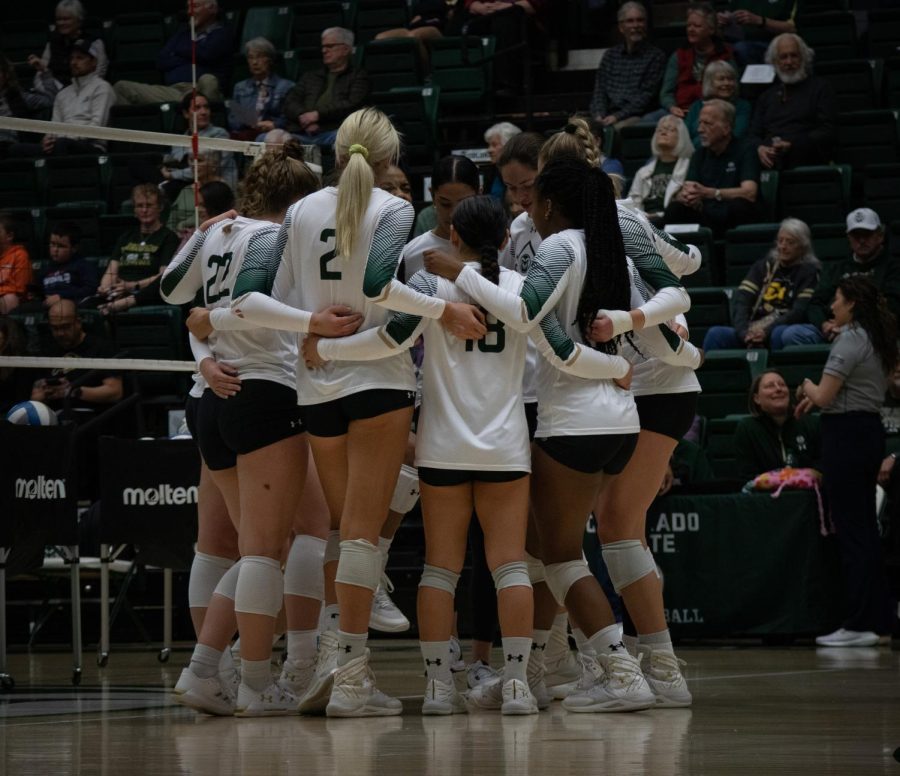 CSU players huddle together to discuss the game plan of their scrimmage against CU Boulder.