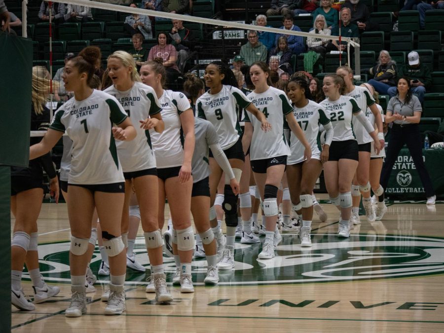 CSU Players give high fives to CU Boulder after the game.