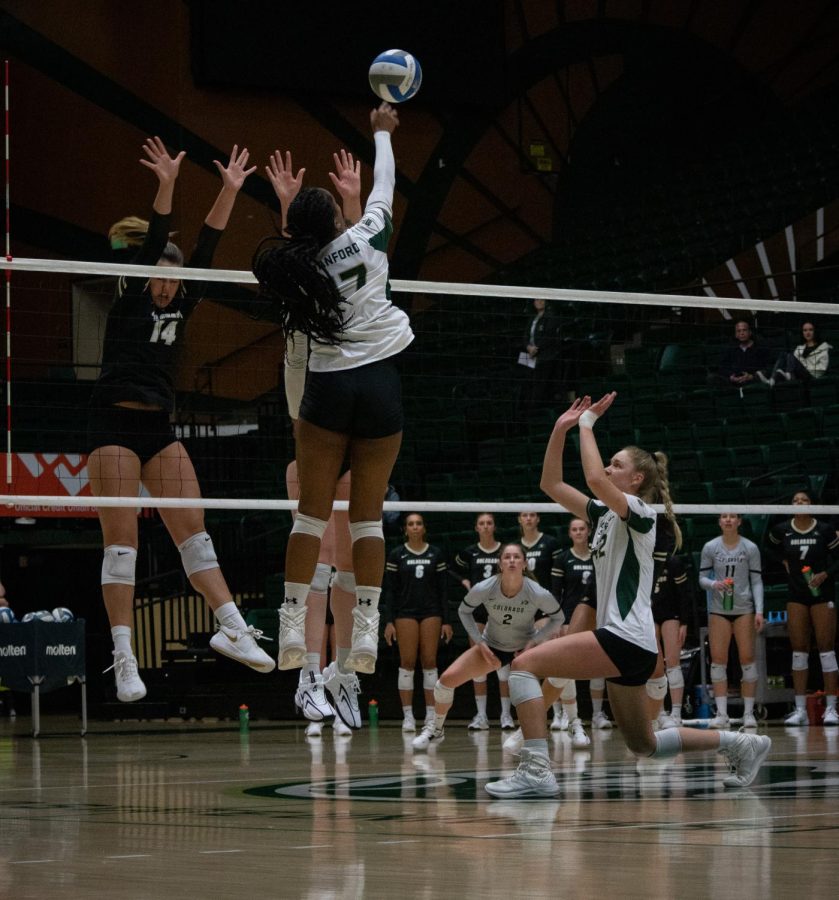 Karina Leber sets the ball to Kennedy Stanford to get a kill for CSU.