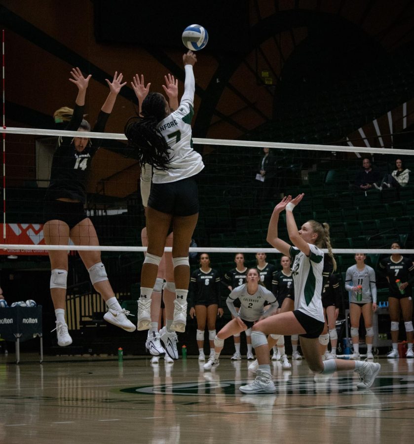 Karina Leber sets the ball to Kennedy Stanford to get a kill for CSU.