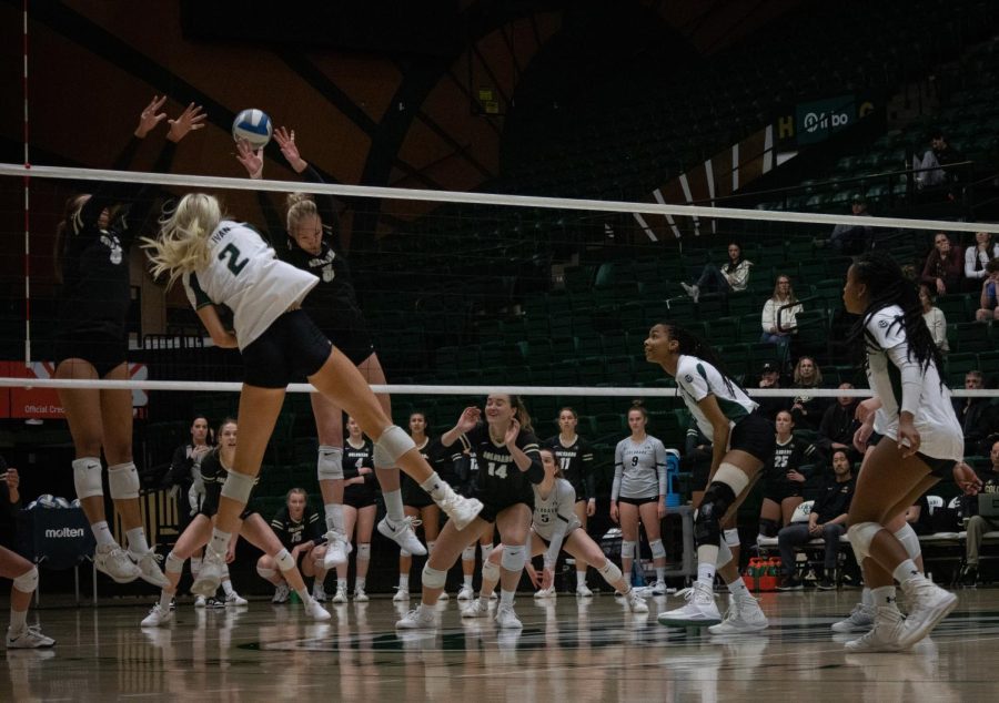 Outside hitter, Annie Sullivan, spikes the ball to win a point for CSU.