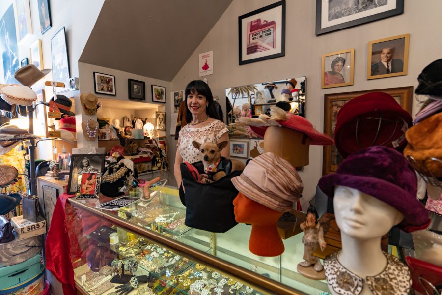 Kim Sewald, proprietor of vintage store Wear It Again, Sam, works behind the counter with her dog, Cecil April 9. The Old Town store sells vintage pieces that are consigned or found by Sewald in places like estate sales, and rents Victorian, wild west, and other themed costumes.
