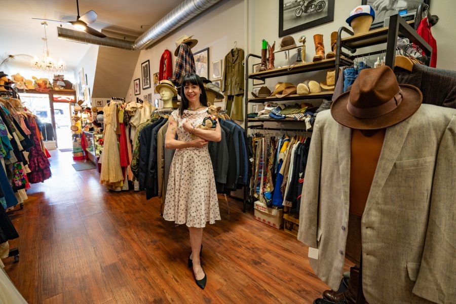 Kim Sewald stands in the mens section of her vintage clothing store, Wear It Again, Sam with her dog Cecil April 9. Im just constantly on the hunt, like estate sales, garage sales, ARC, wherever, Sewald says about the pieces she finds to sell in the Old Town shop. My job is to find it and I will find it. Sewald, who has worked here for twenty years, is the third owner of the store, which has been selling quality vintage pieces since 1988.