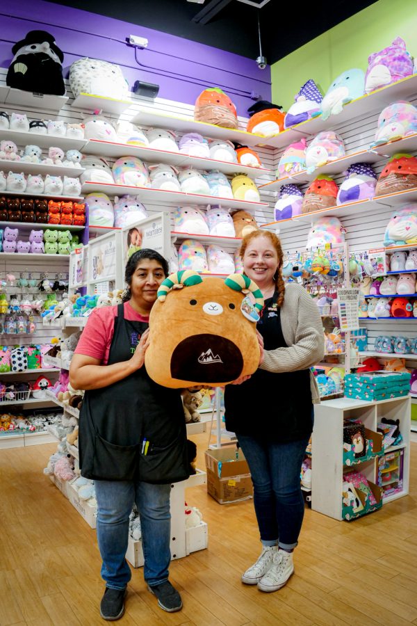 Learning Express Toys Owner Brinda Choquette and an employee, Paige Renner, showcase the rams Squishmallow in their store April. 24. The special edition squishmallow was designed by a former artist that worked for the store, Choquette and Renner introduced to Colorado State University, which can be found at the bookstore. 