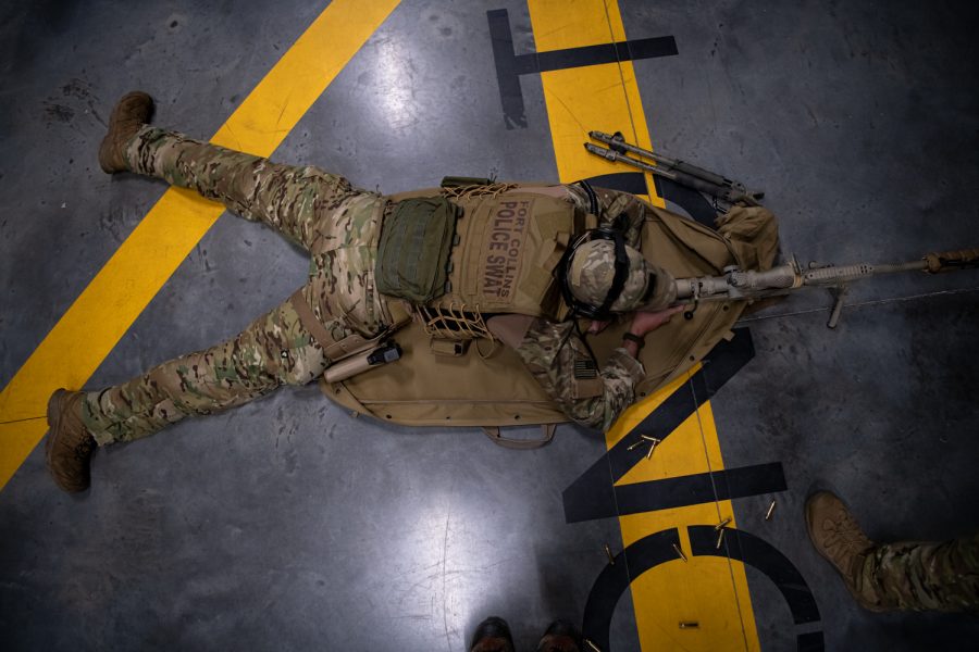 A Fort Collins Police Services Special Weapons and Tactics team member lies in the prone position during a monthly sniper qualification Sept. 27, 2022.
