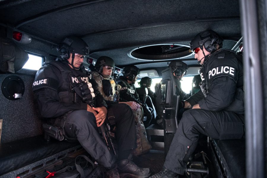 Members of the Fort Collins Police Services Special Weapons and Tactics team prepare for a warrant service call Oct. 5, 2022.