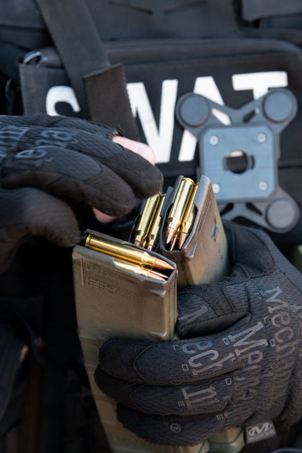 A member of the Fort Collins Police Services Special Weapons and Tactics team loads rounds of .223 frangible ammo into a magazine during practice Oct. 5, 2022.