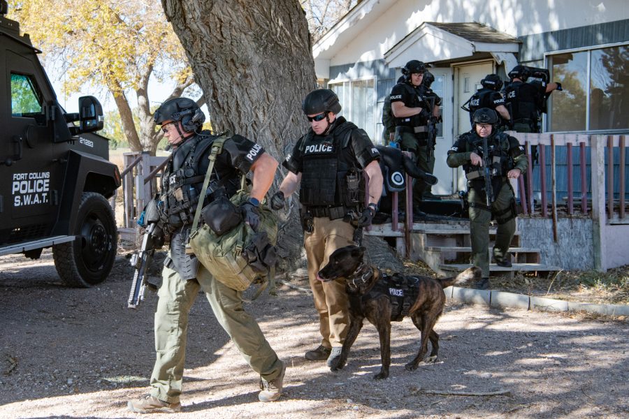 Members of the Fort Collins Police Services Special Weapons and Tactics team end a scenario during their monthly practice Oct. 19, 2022. During practices, the team trains on several scenarios, including hostage rescue, barricaded suspects, search warrants and active shooters.