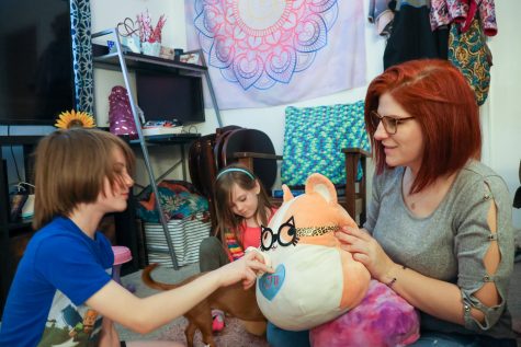 Jackson, Alyanna and Jess Fitchett play together after a long day of school for all of them April 21. Fitchett, mother to Jackson and Alyanna, is a single parent who juggles parenting and college life.