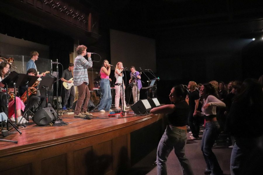 The audience dances as World Domination performs on May 19 at Denver Community Church. Proceeds were donated to Western States Cancer Research and LuvFromLily.
