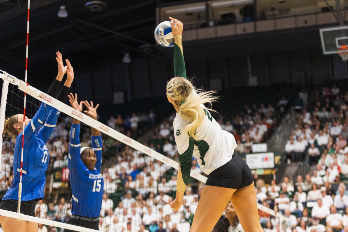 Colorado State outside hitter Annie Sullivan (2) blocks a hit during the volleyball game against Kentucky Aug. 25. CSU won 3-1.