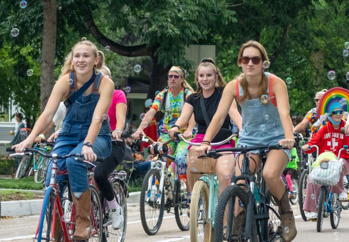 A group of girls ride in the Tour de Fat costumed bike parade following a country theme Aug. 26. Tour de Fat is celebrating its 24th year with a day full of free activities for people of all ages.