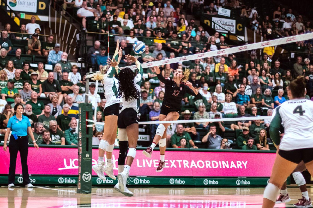 Colorado State University Middle Blocker Naeemah Weathers (9) and Outside Hitter Annie Sullivan (2) block the ball during the volleyball game against Stanford University Aug. 26.