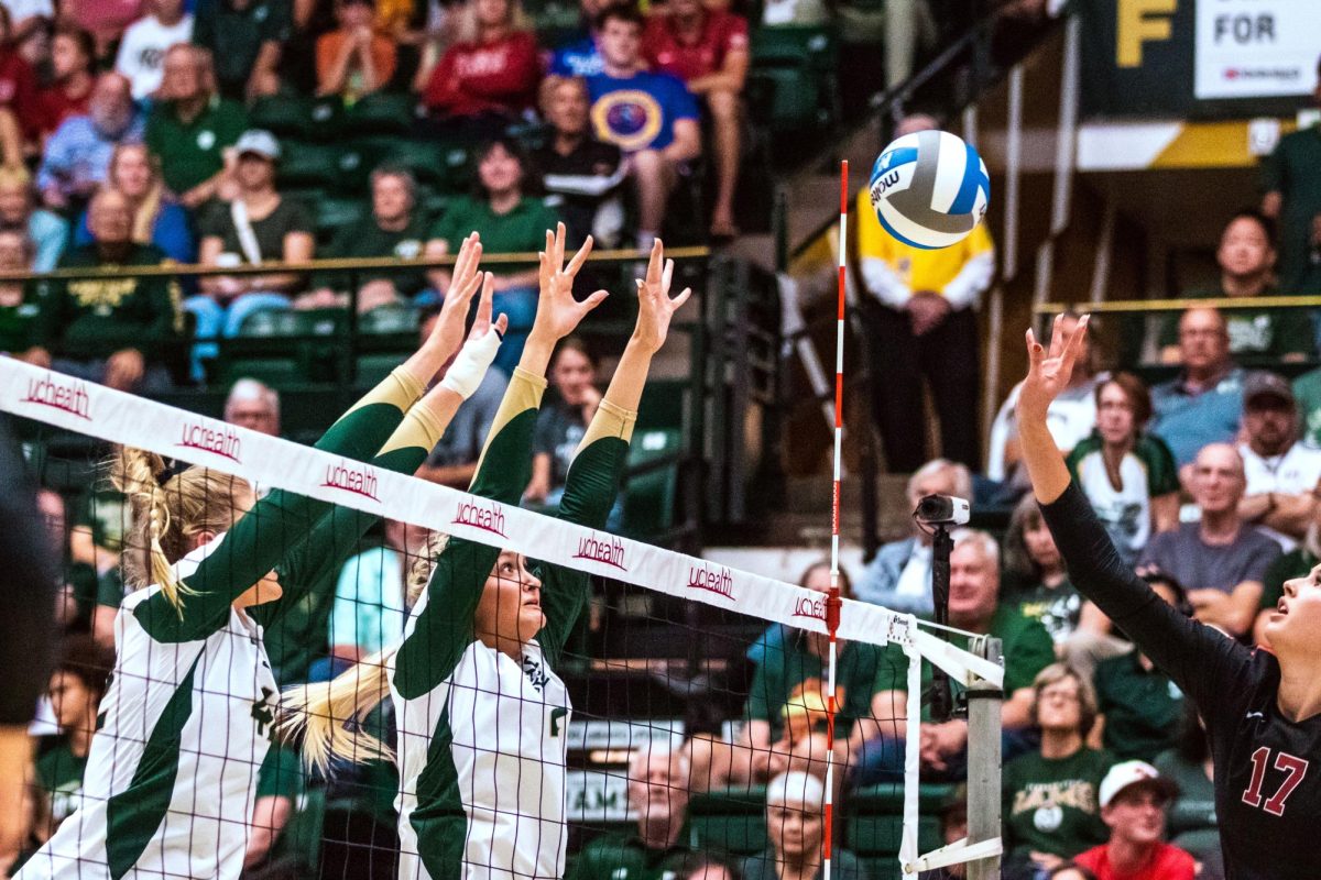 Colorado State University Middle Blocker Karina Leber (42) and Outside Hitter Annie Sullivan (2) block the ball during the volleyball game against Stanford University Aug. 26. Stanford won 3-1.
