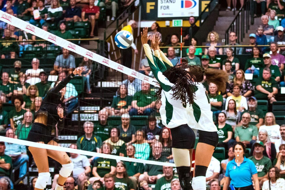 Colorado State University players block the ball during the volleyball game against Stanford University Aug. 26.