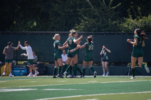 The Colorado State University Womens Soccer team celebrates a goal scored by CSU player Katy Coffin (14). 