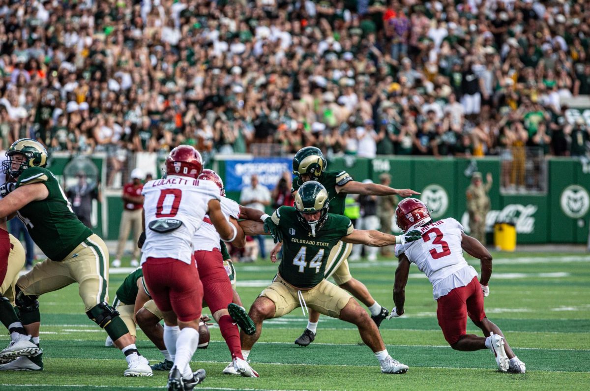 Colorado State University Tight End Peter Montini (44) stopped two players from blocking a CSU field goal early in the first quarter vs the Washington State University Cougars at Canvas Stadium Sep. 2. CSU lost 24-50. Photo by River Kinnaird.