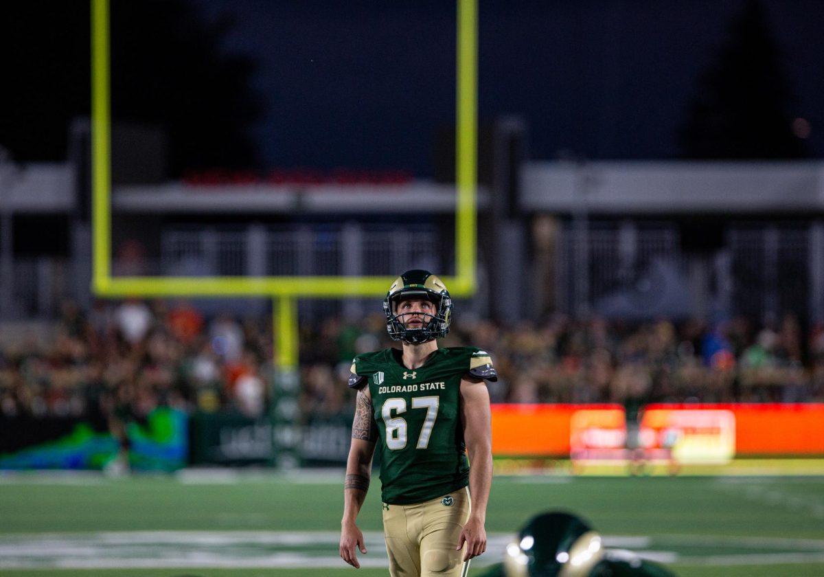Colorado State University kicker Jordan Noyes (67) prepares to make an extra point on CSU's first touchdown vs the Washington State University Cougars at Canvas Stadium Sep. 2. CSU lost 24-50. Photo by River Kinnaird.