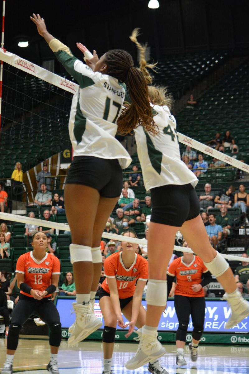 Kennedy Stanford (17) and Karina Leber (42) block a hit from Bowling Green State University Sep. 7. After a close game, Colorado State beat BGSU 3-2.