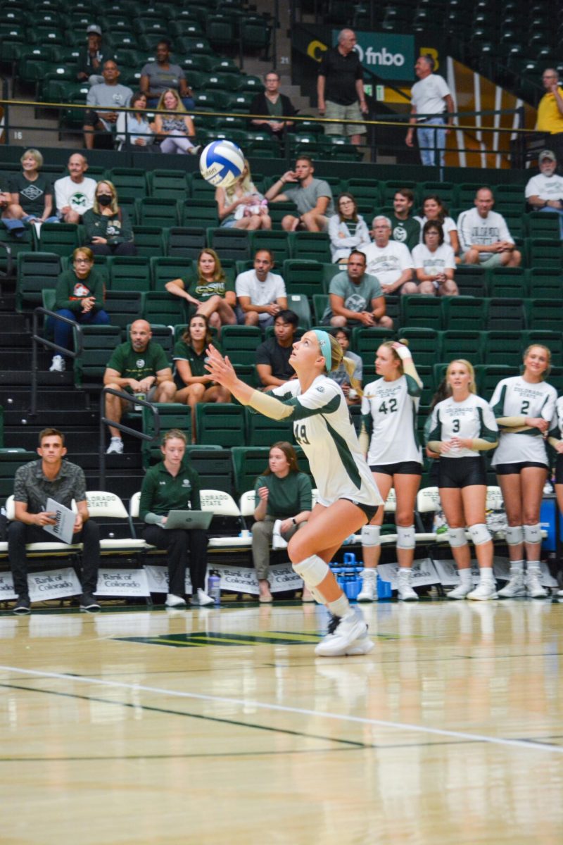 Ruby Kayser (49), a Colorado State University defensive specialist, watches the ball as she prepares to serve Sep. 7. CSU beat opponent Bowling Green State University 3-2 in a close game.
