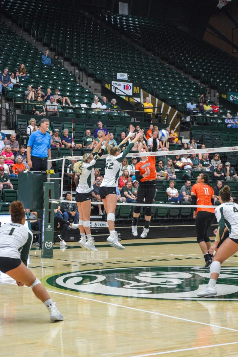 Annie Sullivan (2) and Karina Leber (42) block a hit from Bowling Green State University Sep. 7. After a close game, Colorado State beat BGSU 3-2.
