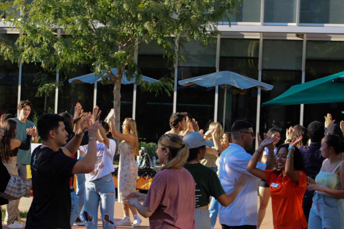 Colorado State University students volunteer to learn the Bachata at the National Latinx Heritage Month launch Sept. 13. After each round of moves, partners would high-five and then switch to the next partner to allow everyone to get to know one another. 