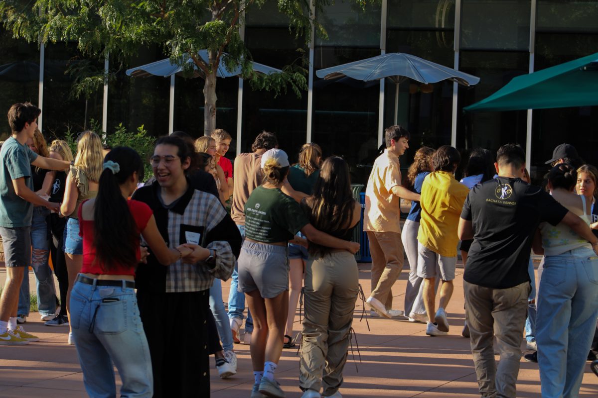 Colorado State University students share laughs and meet new people while learning how to do the Bachata dance at the Sutherland Garden for the launch of the National Latinx Heritage Month Sept. 13. Dancers from Bachata Denver came up to teach the Bachata to any students who were interested in learning something new as well as learning more about the Latinx culture. 