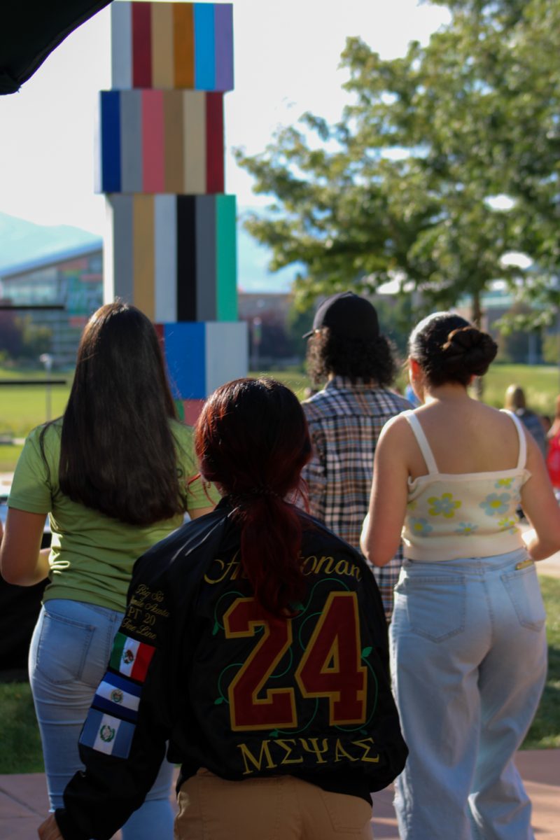 Colorado State University students gather around the stage to get instructed by the dance instructors from Bachata Denver Sept. 13. Latinx students show off their pride by wearing their respective flags and family names. 