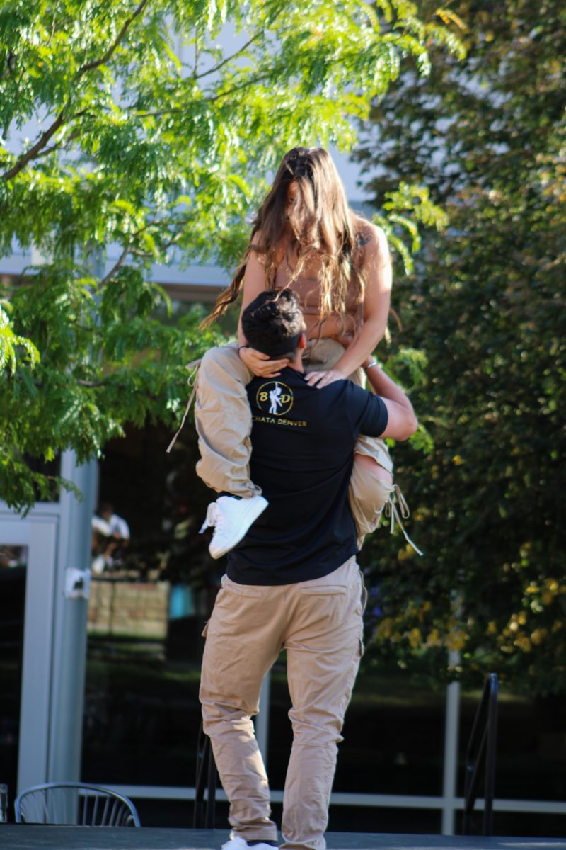 Dance students from Bachata Denver open up the National Latinx Heritage Month launch by showing off one of their duets at Colorado State University’s Sutherland Garden Sept. 13. They perform their duet before giving instruction to those who participated in learning how to do the Bachata dance. 