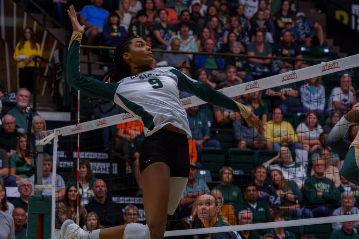 Senior Naeemah Weathers (9) prepares to spikes a ball during a match between Colorado State University and Colorado Boulder held at Moby Arena Sept. 15.