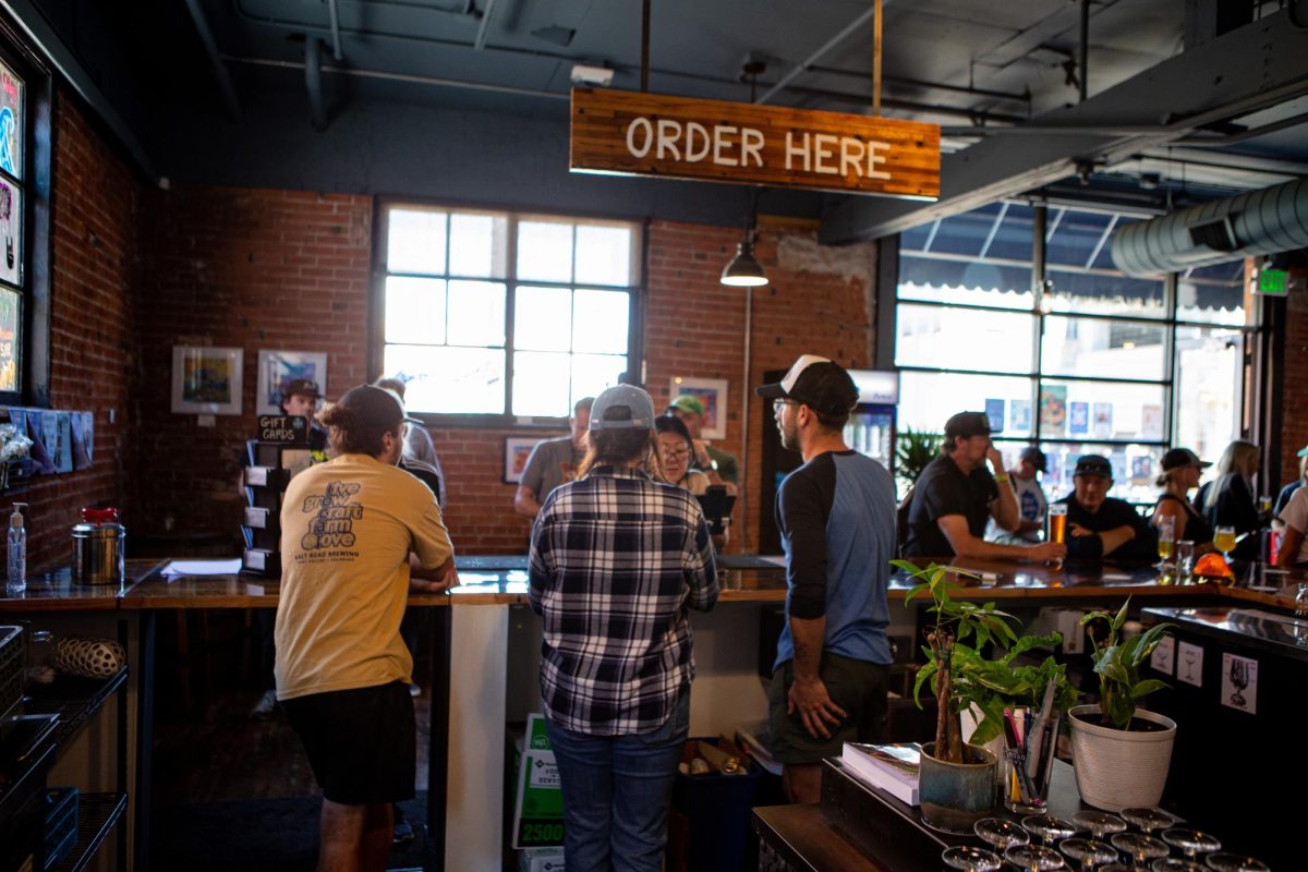 Salt Road Brewing employees help patrons  celebrate Oktoberfest during their event Sep. 23. The brewery is located at 321 Firehouse Alley and saw its first Oktoberfest ever this September.