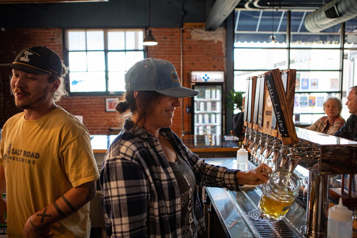 Salt Road Brewing bartenders Zach Farrin (left) and Suzy Hawbaker (right) pour beers with smiles on their faces during the brewery's Oktoberfest Sept. 23. "The best part about this job is the people who come in all the time," Hawbaker said. "We love talking with and getting to know more about our regulars and the people of Fort Collins."