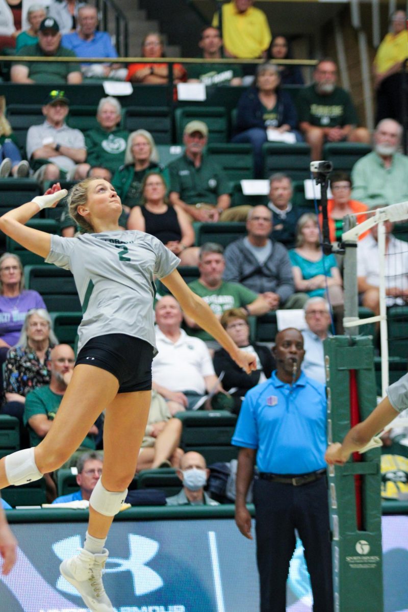 Colorado State University outside hitter Annie Sullivan (2) spikes the ball back to San Deigo State University Sept. 28. After losing the first set to SDSU, CSU managed to win three in a row resulting in a win.