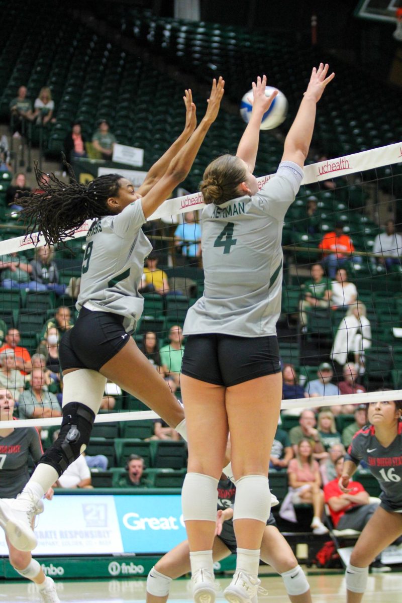 Colorado State University middle blocker Naeemah Weathers (9) and setter Emery Herman (4) block a hit from San Diego State University Sept. 9. Together, Weathers and Herman scored a combined 13.5 points.