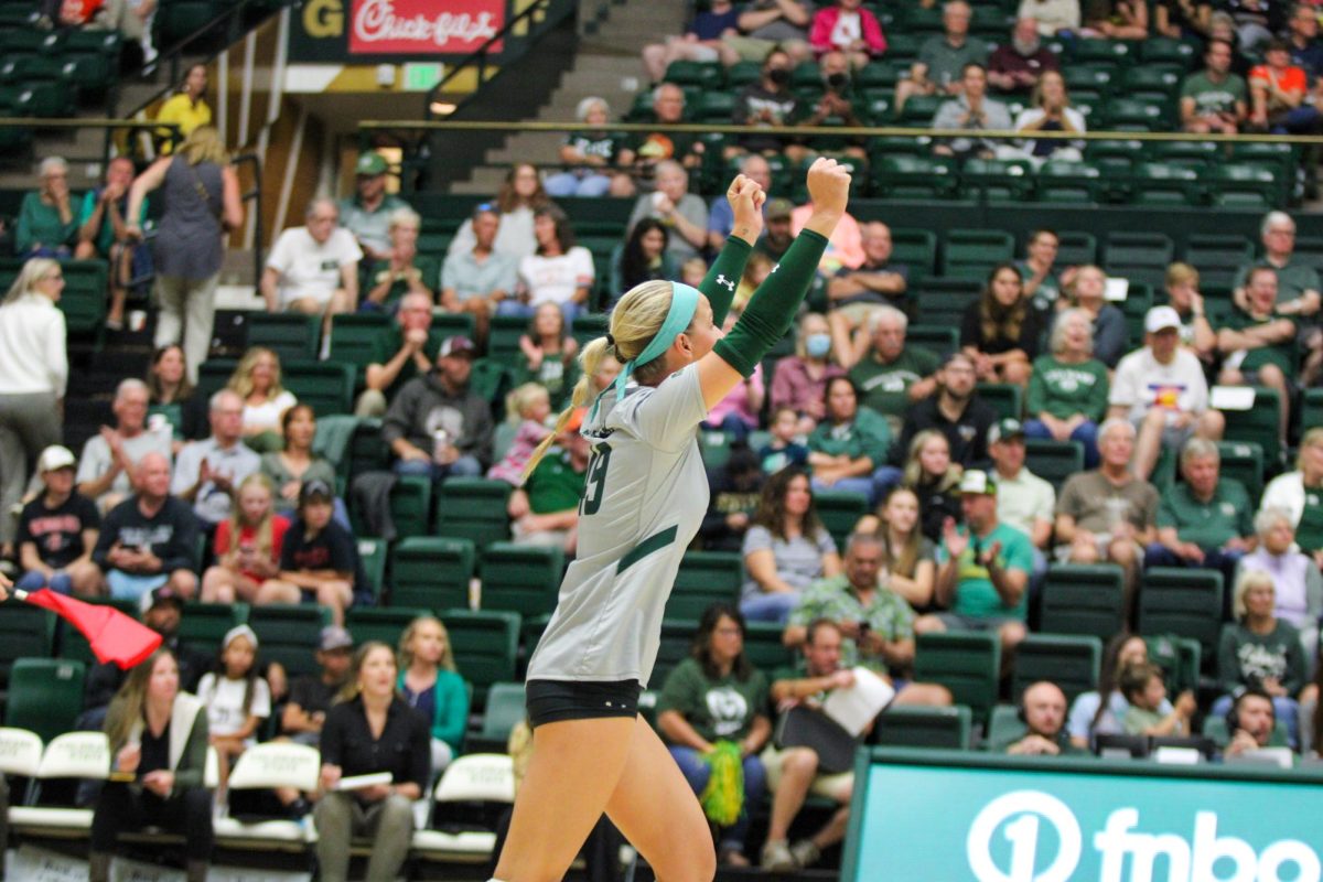 Colorado State defensive specialist Ruby Kayser (49) throws her hands up in celebration after CSU scores a point Sept. 28.