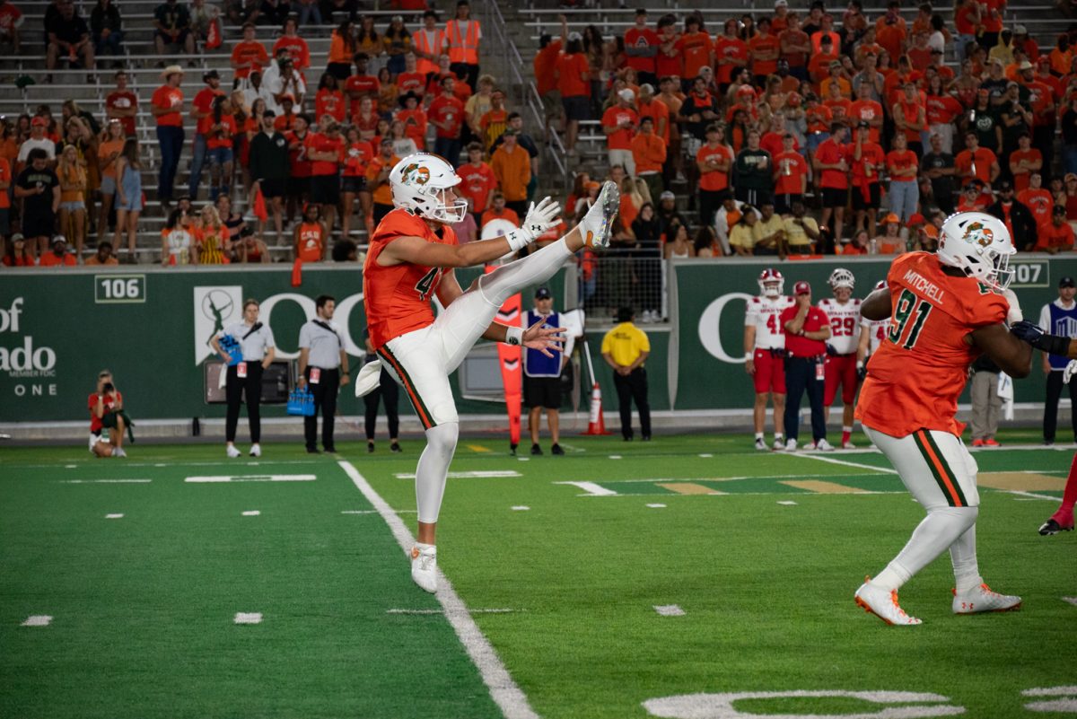 Colorado State University punter Paddy Turner (41) scores a field goal after a touchdown.
