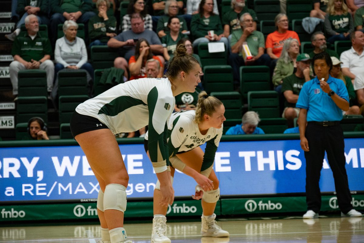 Colorado State University volleyball players ready themselves for San Jose State's serve.
