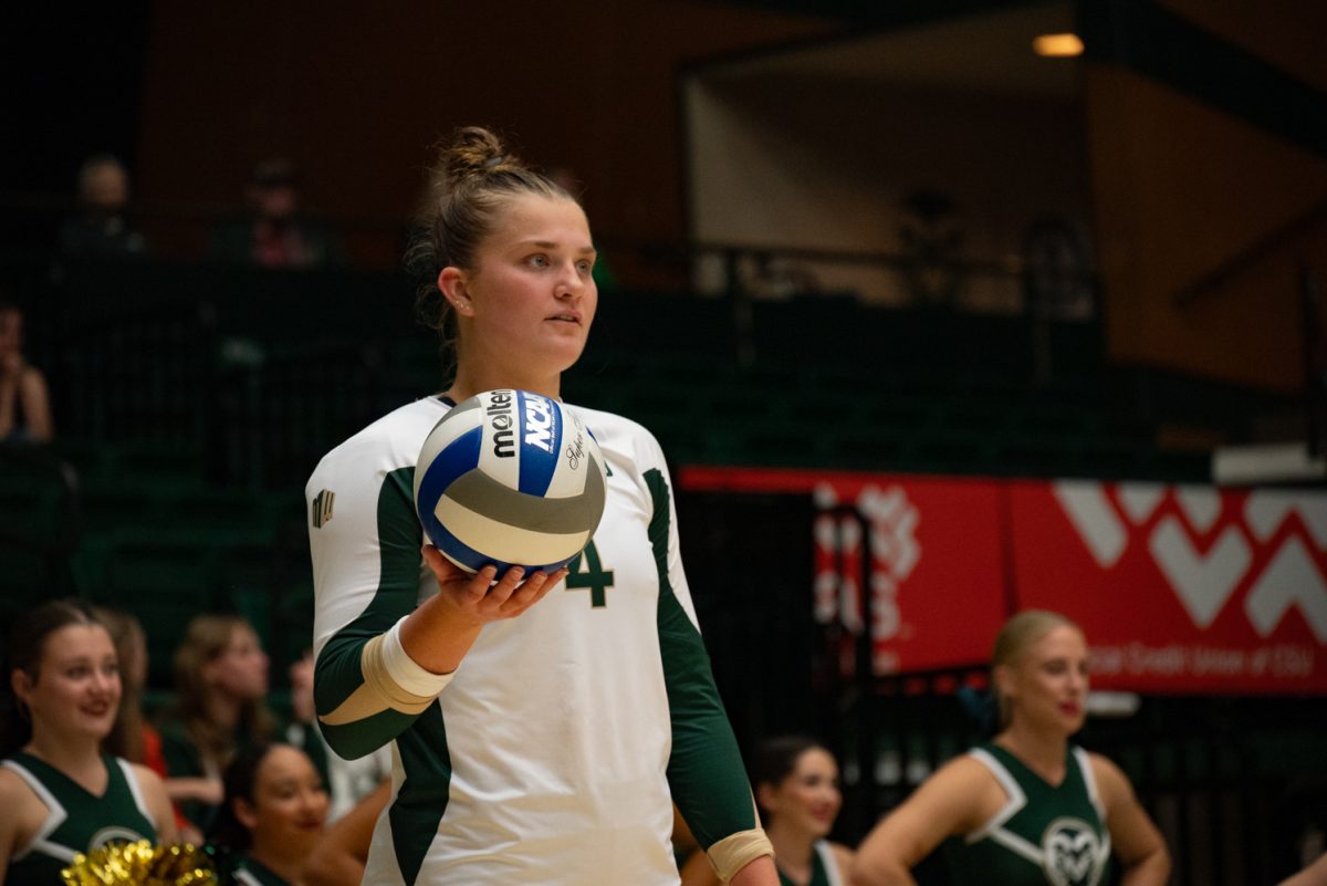 Colorado State University senior Emery Herman (4) takes a breath before serving to San Jose State.