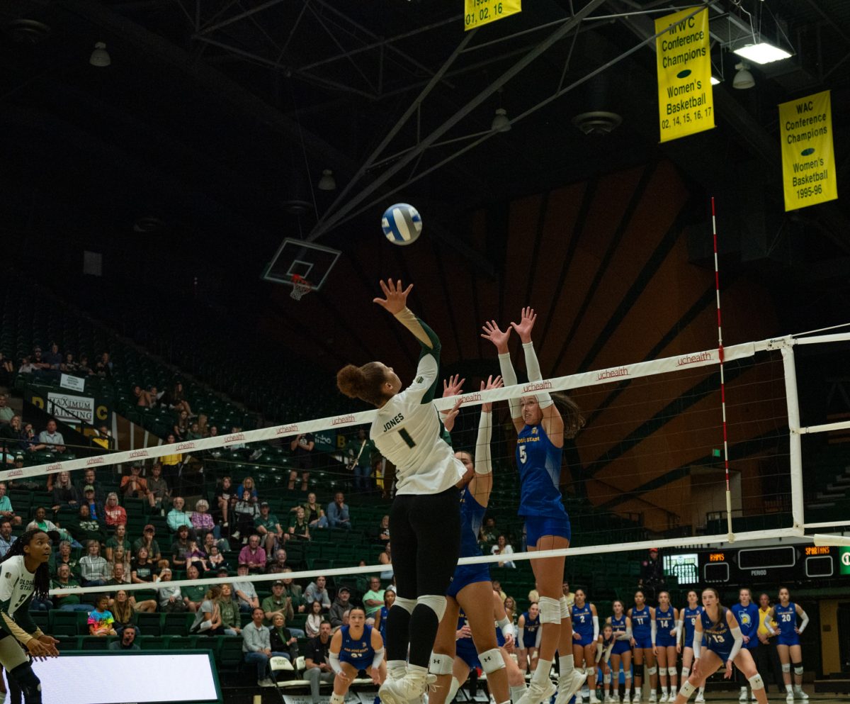 Colorado State University redshirt junior Malaya Jones (1) spikes the ball over the net.